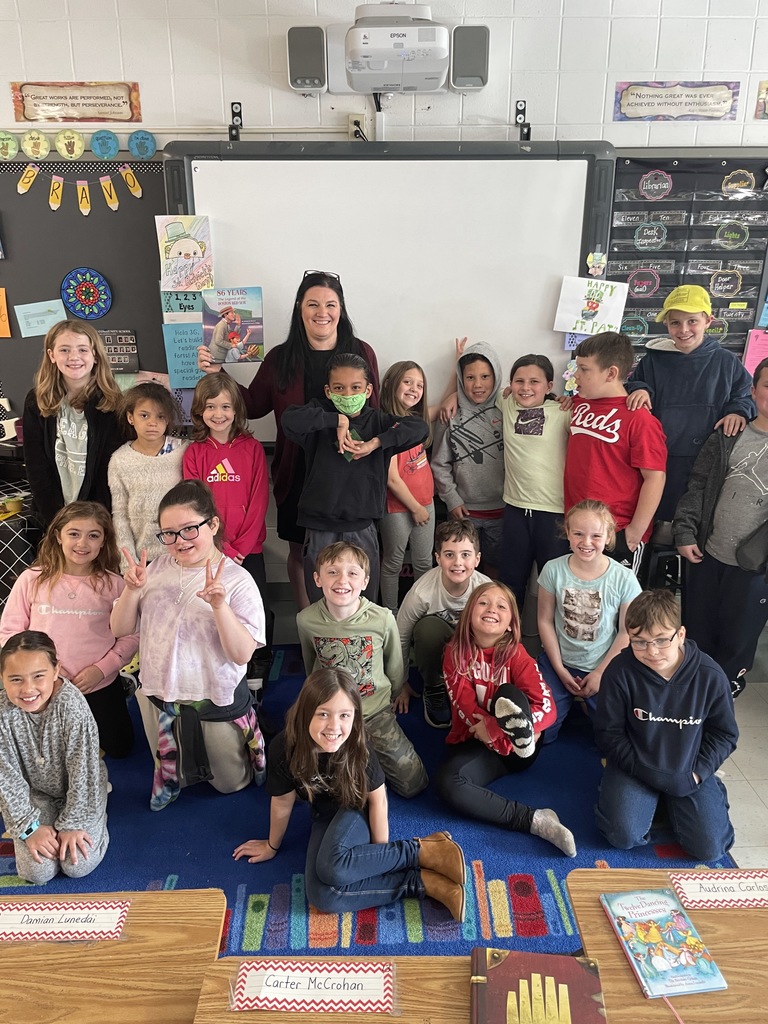 Superintendent Ryan posing with Ms. Guilmette's class after being a guest reader