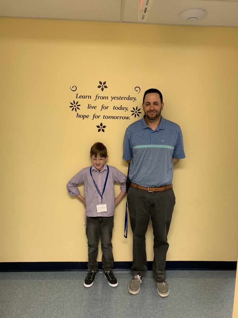 Student Principal of the Day standing with Mr. Andrade