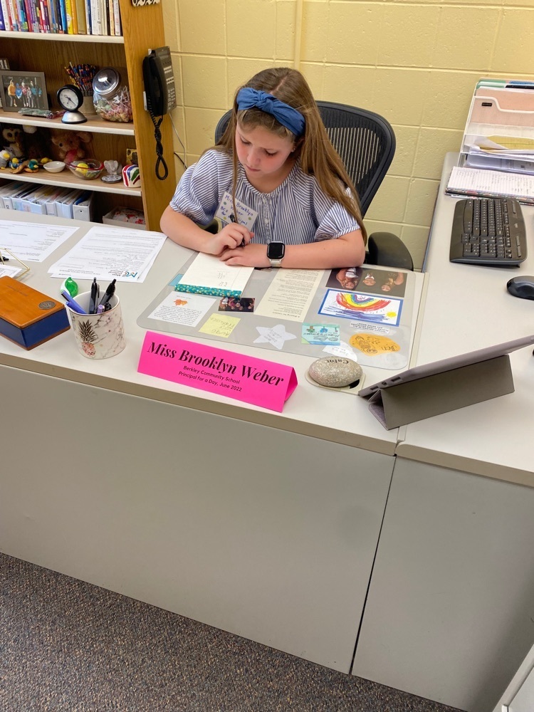 student working at the principal desk 
