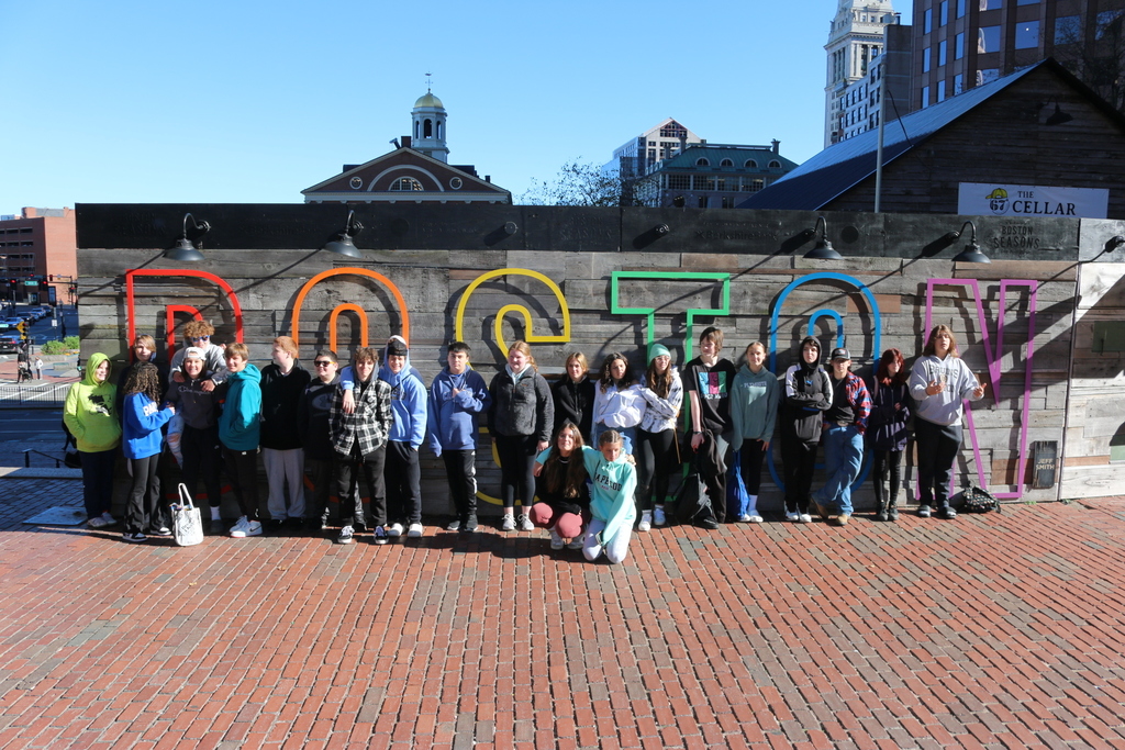 Grade 8 Standing in front of the Boston sign