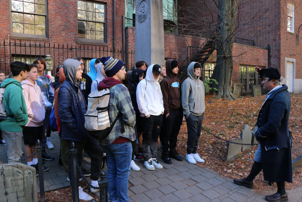 Grade 8 students listening to the tour guide of the Freedom Trail