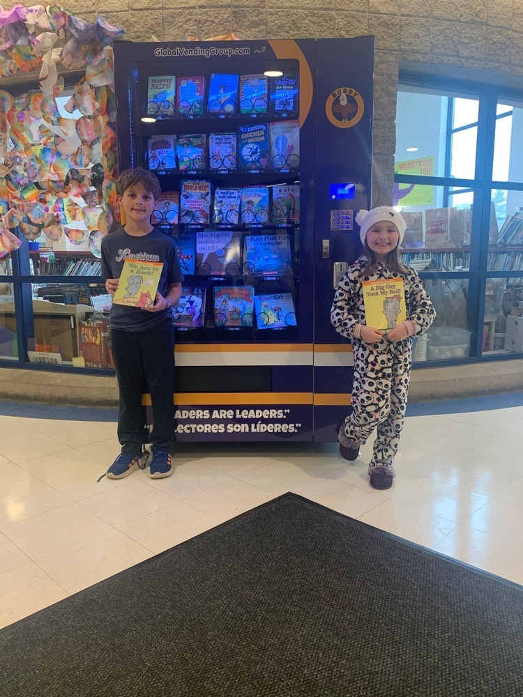 students with the book vending machine  