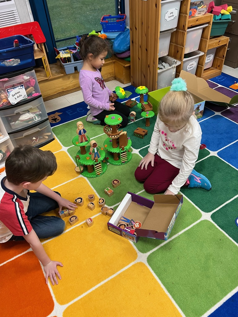 Kindergarten playing with their new toys