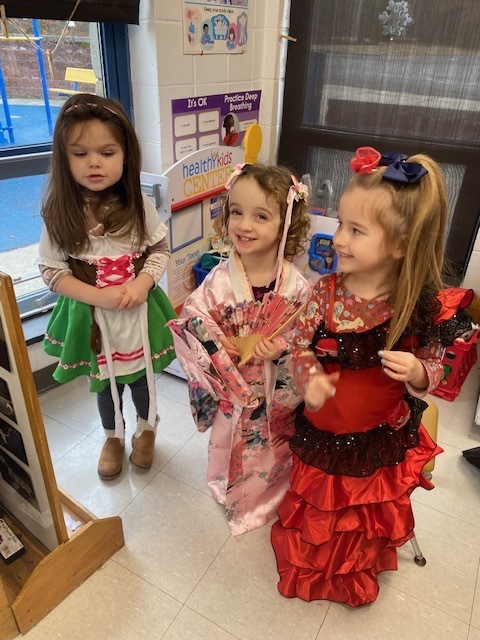 Preschool students dressed up in multicultural dress up clothes