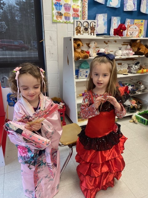 Preschool students dressed up in multicultural dress up clothes